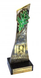 autorska statuetka zaprojektowana dla: statuetka dla Gminy Debe Wielkie, mosiądz patynowany , liść kryty zieloną emalią